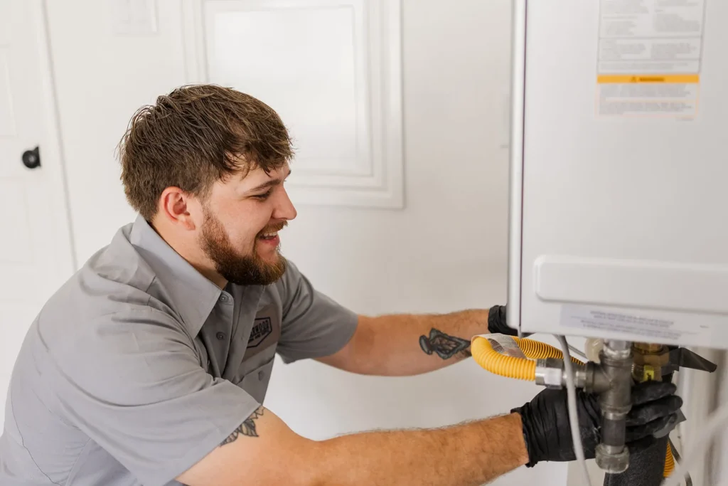 Underwood plumber working on a residential water heater